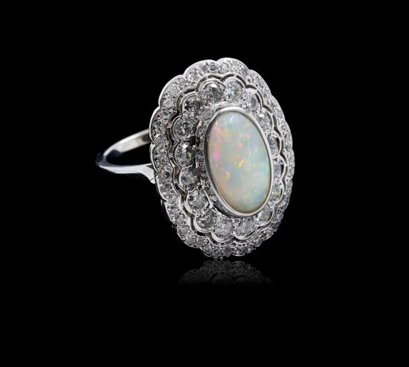 Importante bague ancienne platine opale et diamants