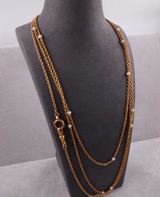 Long sautoir or et perles fines