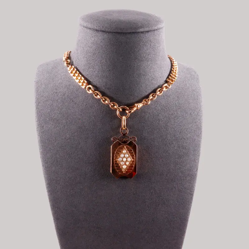 Chaîne de montre et son médaillon ouvrant en or rose