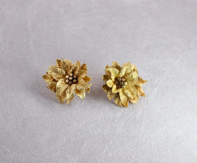 Boucles d'oreilles clips Hermès feuilles or