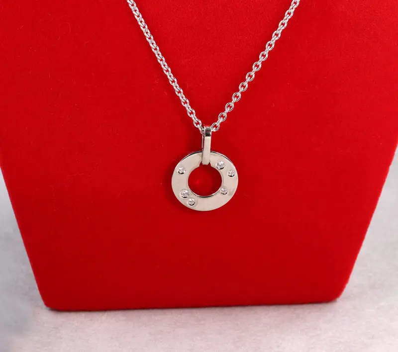 Pendentif vintage Dinh Van or blanc diamants