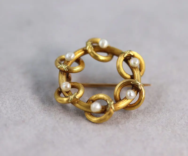 Broche or jaune et perles fines