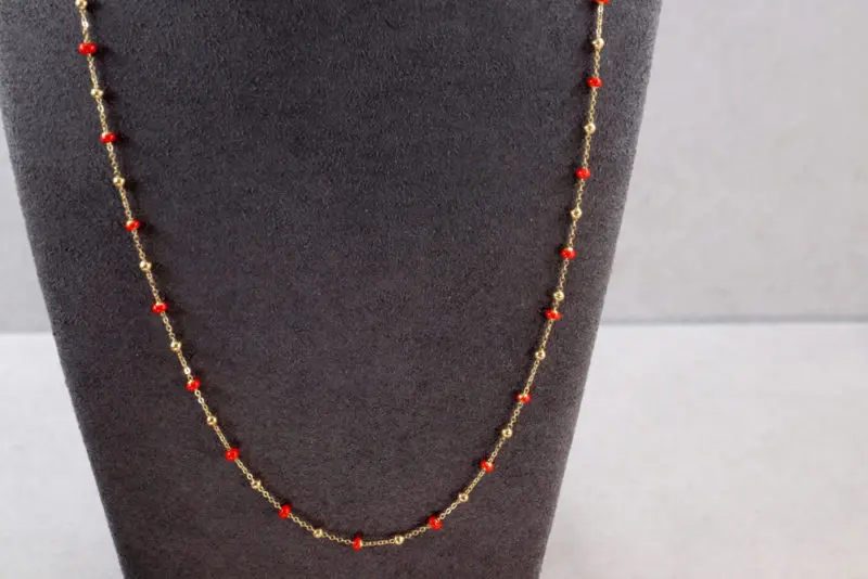 Collier boules d'or et boules émail orange